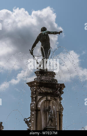 Statue of Neptune on the top of a fountain at Frederiksborg castle in Denmark, August 3, 2019 Stock Photo