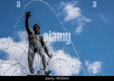 a cascade of water over  Neptune on the top of a fountain at Frederiksborg castle in Denmark, August 3, 2019 Stock Photo