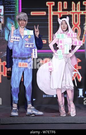 Chinese actor Feng Shaofeng, left, and actress Liu Yifei attend a press conference for their movie 'Hanson And The Beast' in Beijing, China, 15 Octobe Stock Photo