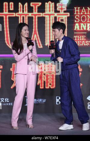 Chinese actor Feng Shaofeng, left, and actress Liu Yifei attend a press conference for their movie 'Hanson And The Beast' in Beijing, China, 15 Octobe Stock Photo