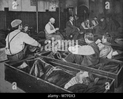 Inside Medland Hall homeless shelter, Ratcliff, London, c1900 (1901). Artist: Unknown. Stock Photo