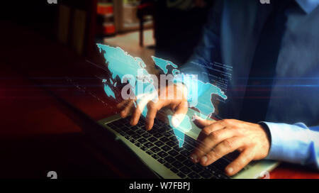 Hacker typing on laptop with world map hologram over keyboard. Futuristic concept of globalization, worldwide network, international business and soci