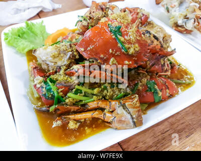 Stir-fried crab curry on white plate. Stock Photo