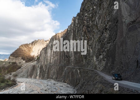 Lahic, Ismayilli region, Azerbaijan - April 27, 2019. Mountainous road leading to Lahic village in Ismayill region of Azerbaijan, with car. Stock Photo