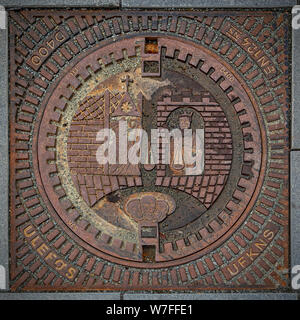 One of the manhole covers special to the city of Trondheim in Norway. Stock Photo