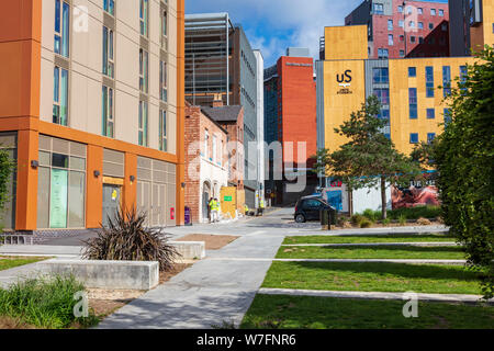 A view up Fox Street from Eastside Millennium Park on Curzon Street shows workmen restoring a historic house, Birmingham, West Midlands, UK Stock Photo