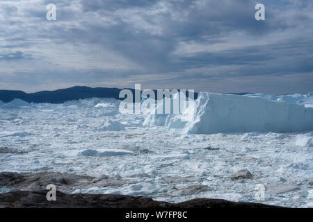 Huge icebergs in the Ilulissat ice fjord, a Unesco world heritage site, near Ilulissat in western Greenland. Stock Photo