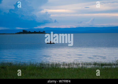 Fishing boat on Lake Kariba, Zimbabwe at sunset Stock Photo