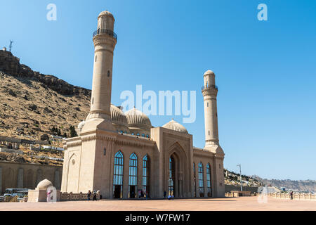 Bibi-Heybat, Baku, Azerbaijan - May 12, 2019. Exterior view of the Bibi-Heybat mosque in Baku, with people. The existing structure, built in the 1990s Stock Photo