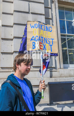 London UK. 5th August 2019. A Pro remain in Europe protester holds an Anti Brexit placard outside the Cabinet Office in Whitehall as the government rules out further talks with the EU promising to leave on 31 October 2019 .Credit : amer ghazzal/Alamy Live News Stock Photo