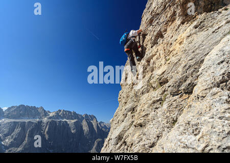 Dolomiti - Female climber on Cir V Via Ferrata, Gardena Pass, Italy Stock Photo