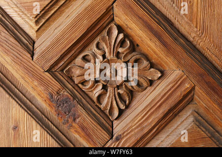 Pattern of flower carved on wood background. Stock Photo