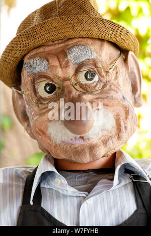 The head of an old man modelled on top of a mannequin, advertising a cafe at the historic citadel at Blaye in France. Stock Photo