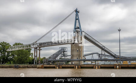 Conveyor belt transportion and unloading/loading system, dockside at the Bordeaux wharfs on the Garonne River, France. Stock Photo