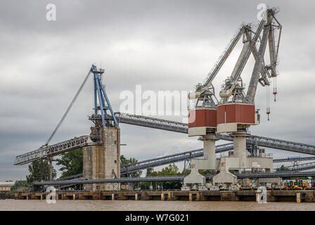 Dockside gantry cranes is use in the wharfs beside the Garonne River, Bordeaux, France. Heavy lift cranes within the industrial estate. Stock Photo