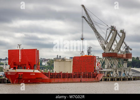 Dockside gantry cranes is use in the wharfs beside the Garonne River, Bordeaux, France. 2003 general cargo ship Laida, under the Spanish flag. Stock Photo