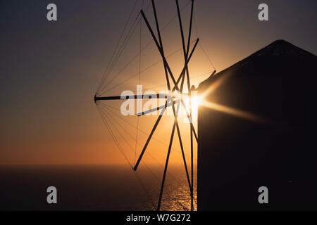 Windmill silhouette in front of the sunset Stock Photo