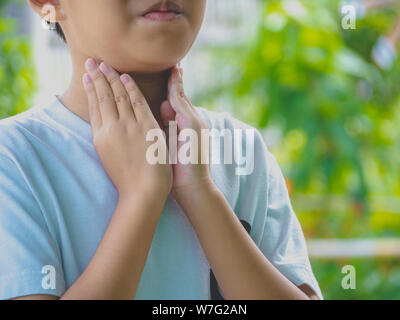 Little ill boy get sore throat or choking can't breath with unhappy. Allergy concept Stock Photo