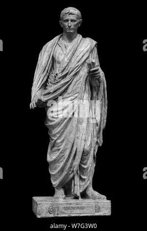 Caesar Octavianus Augustus roman emperor adopted son of Julius Caesar. Isolated statue on black. Stock Photo