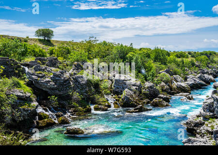 Montenegro, Stunning clean crystal clear turquoise water of cijevna river flowing through rocky green nature landscape of podgorica with blue sky Stock Photo