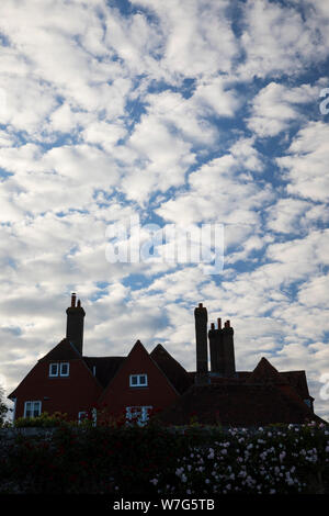 Unusual clouds above silhouetted house, Kent, England, United Kingdom, Europe Stock Photo