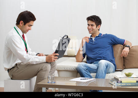 Financial advisor talking to a client Stock Photo