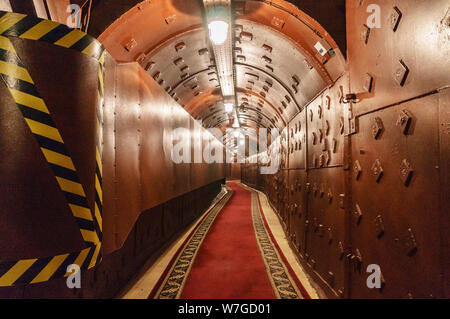 Underground tunnel. Abandoned bunker from cold war. Anti-nuclear underground bunker facility. Tunnel at Bunker-42, anti-nuclear underground facility b Stock Photo