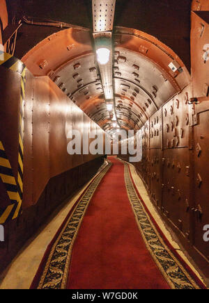 Underground tunnel. Abandoned bunker from cold war. Anti-nuclear underground bunker facility. Tunnel at Bunker-42, anti-nuclear underground facility b Stock Photo