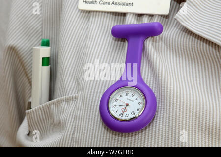 An NHS nurse's fob watch. Stock Photo