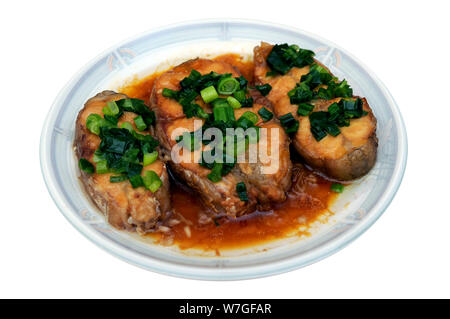 three slices of cooked catfish on dish Stock Photo