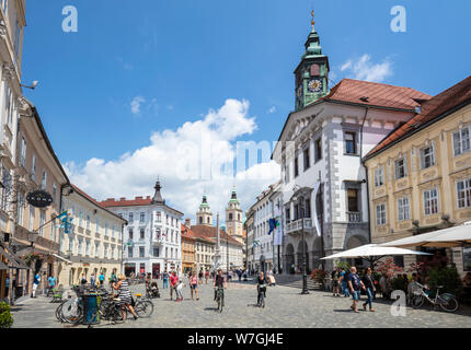 People tourists and cyclists in the Town Square in front of the Ljubljana Town Hall Stritarjeva ulica Old Town Ljubljana Slovenia Eu Europe Stock Photo