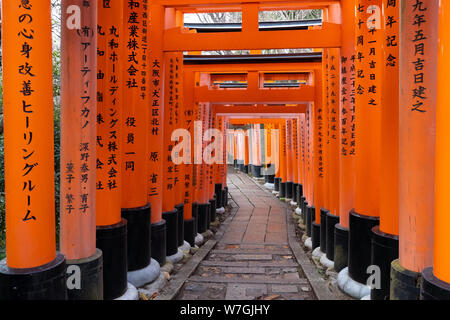 KYOTO, JAPAN, APRIL 01, 2019 : Perspective view inside the torii tunnel of the Fushimi Inari shrine Stock Photo