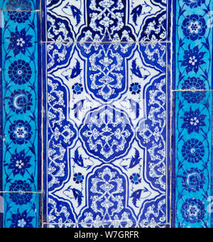Texture of ceramic tiles in oriental East style. Turkish ceramic tiles lined on the wall. Old pattern floral ornament on tiles. Ottoman traditional ar Stock Photo