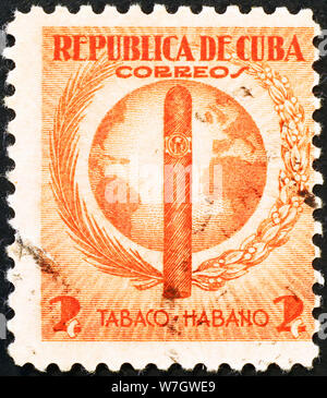 Tobacco industry celebrated on very old cuban postage stamp Stock Photo