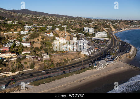 Aerial of Pacific Palisades homes and buildings along Pacific Coast Highway at Sunset Blvd in Los Angeles, California. Stock Photo