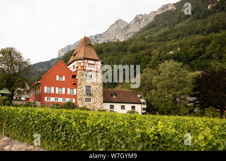 The Red House in Vaduz, Liechtenstein, is a famous private home built in 1338 and surrounded by the Prince's royal vineyards. Stock Photo