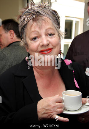 Jo Brand controversial comedian enjoys a cup of tea whilst visiting a London NHS mental health ward. Editorial image Stock Photo
