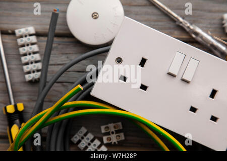 Electrical tools and equipment on a wooden background Stock Photo