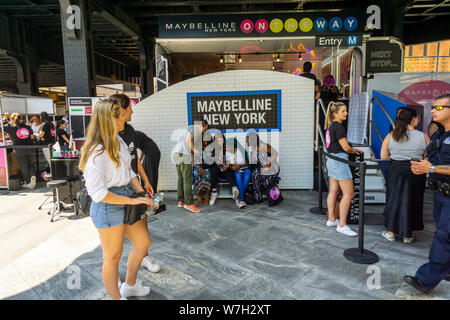 Visitors celebrate National Lipstick Day at a Maybelline pop-up branding event in Hudson Yards in New York on Monday, July 29, 2019. The Maybelline On The Way Pop-Up offered free samples of the comapny’s lipstick as well as mini-brow makeovers. Maybelline is a brand of L’Oreal with its headquarters located in 10 Hudson Yards.(© Richard B. Levine) Stock Photo