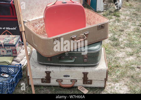 Vintage suitcases stacked on top of each other for sale Stock Photo