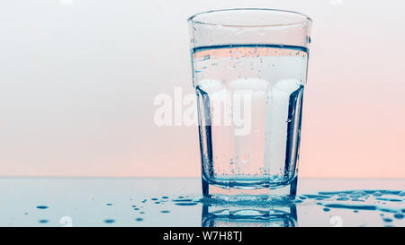 Carbonated soda water in drinking glass - refreshing fizzy sparkling mineral liquid Stock Photo