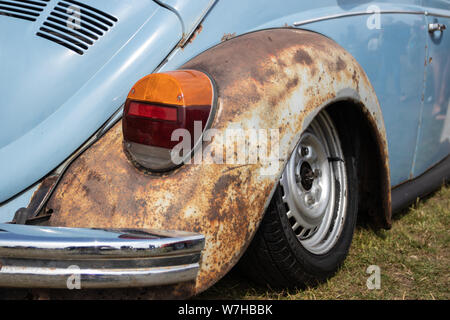 A rusted wheel arch on a vintage car Stock Photo