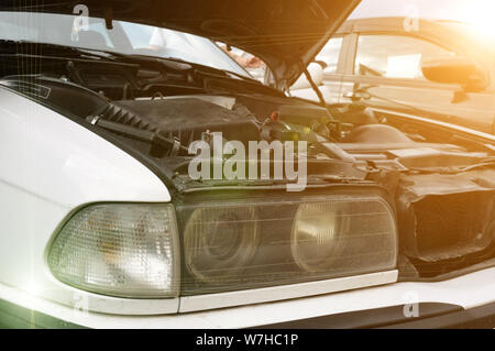 Open car engine hood. Checking the condition of the engine, an electronic system to carefully check the damage, to repair the engine and complete its Stock Photo