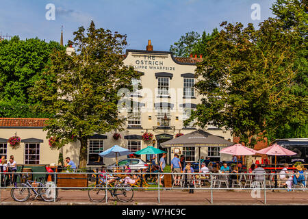 The Ostrich, a historic harbourside pub now run by Butcombe Brewery, on a sunny summer day with people enjoying the garden. Bristol, UK. July 2019. Stock Photo