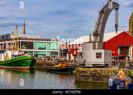 Historic vessels moored outside Bristol's M-Shed heritage museum, alongside the Fairbairn steam crane. Prince's Wharf, Bristol, UK. July 2019. Stock Photo