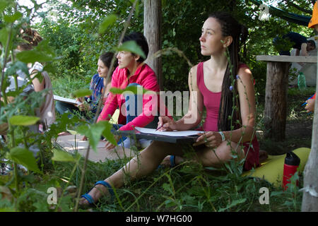Kharkiv, Ukraine - July 09, 2019: A group of young people make a watercolor sketch on an outdoor plein air Stock Photo
