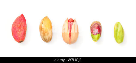 Top down view, pistachios in different stages from raw, through roasted and salted to peeled green, isolated on white background. Stock Photo