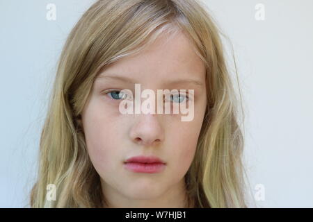 Portrait of an adolescent child with a defiant glare Stock Photo