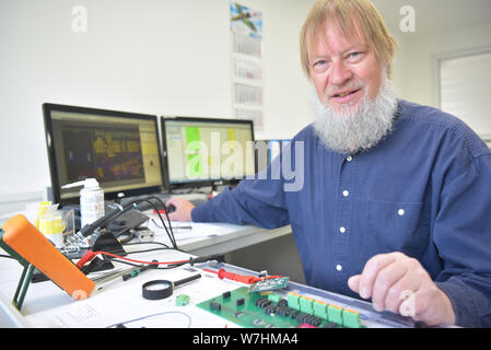 engineer at the workplace - assembly and development of electronics in a modern factory Stock Photo