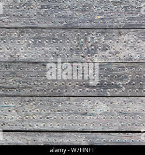 construction background - stack of gray railroad ties made of recycled composite materials Stock Photo